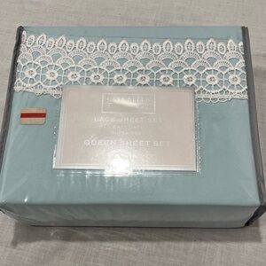 Queen bedsheets NWT. Light blue with lace details.